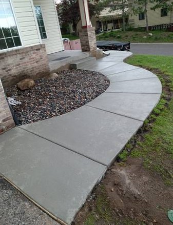 This image a is project done by our concrete contractors nj team in 2018. This project was a concrete walkway done by one our customers in NJ. The concrete is wet.